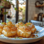 Light, crisp, and filled with love—mini kunafa cream puffs.